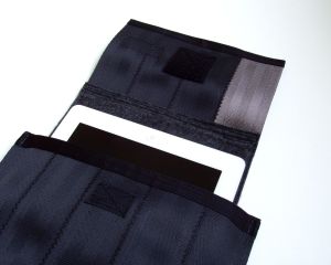 The C-5 is sized for an iPad. Pull on the flap to lift your device out of the case.