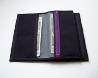 Two large slots for paper money / receipts plus another lined zippered pocket.
